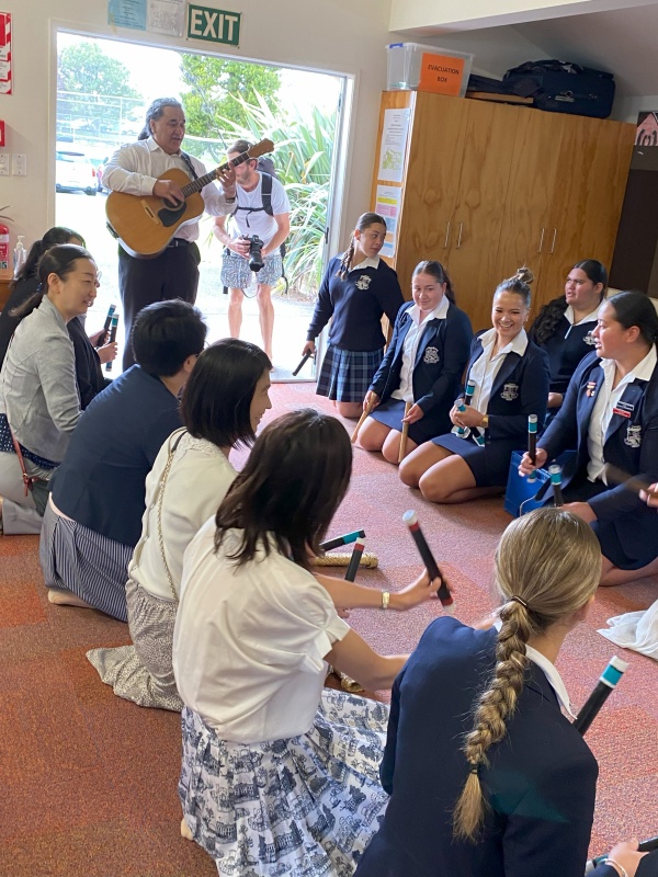 Japanese teachers playing a Māori stick gamge